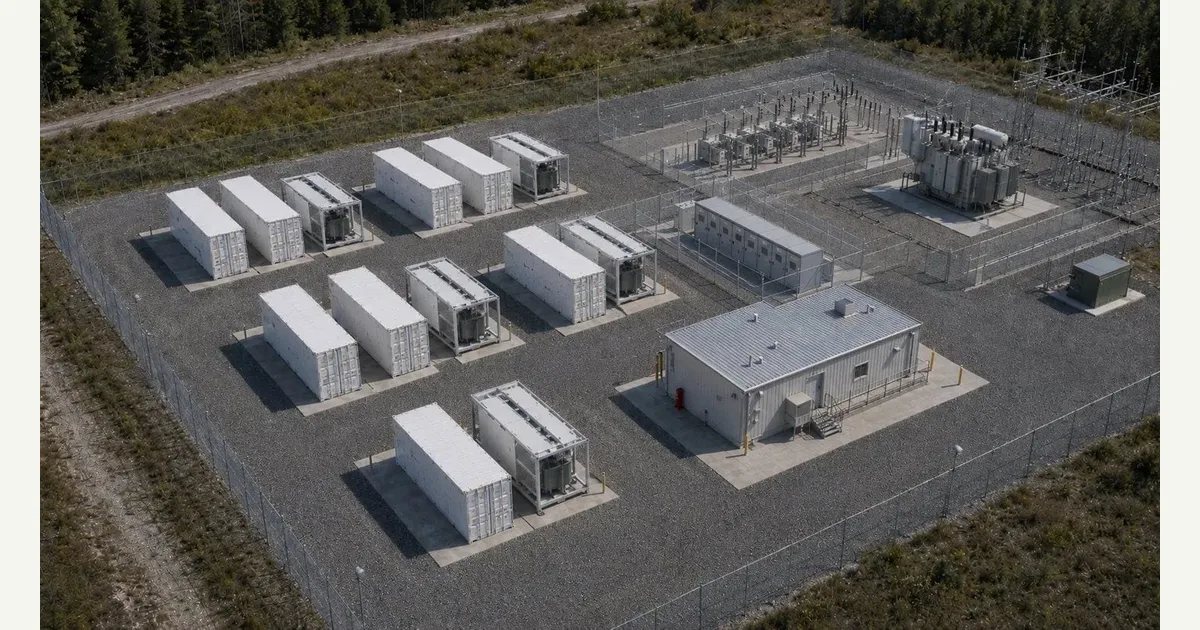A real grid-scale BESS: container rows, the MV/HV substation, and the control building.
